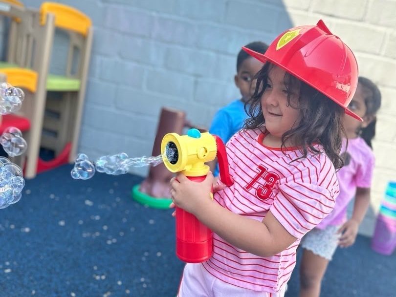 Children playing together in the ESPIN outdoor play space.